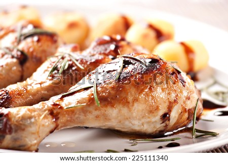 Roast chicken with potatoes on a plate