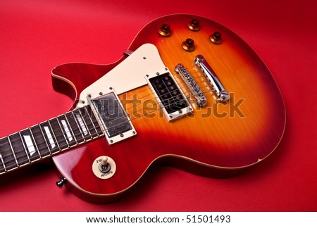 Still life guitar on a red background