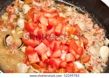 Close up with seafood sauce in a pan