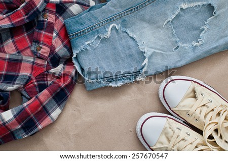 Crumpled red blue checked shirt, jeans  and shoes
