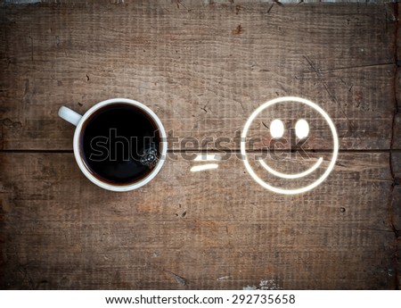 black hot fresh coffee espresso in white cup, equal sign and smile on vintage grunge wooden background