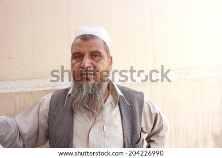 Old man posing for photographer