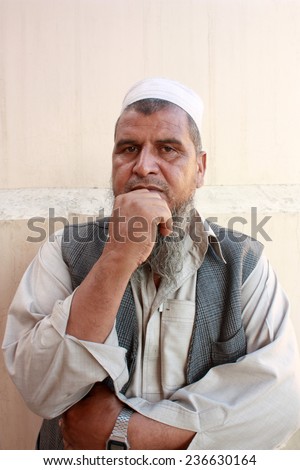 Old man posing for photographer