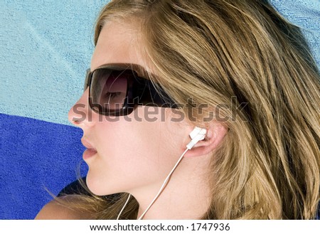 Quiet teenager listening her digital music player.