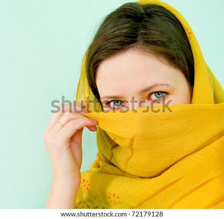 beauty with a yellow scarf, masked person
