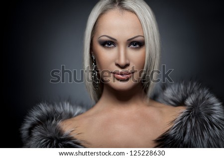 Woman in Luxury Fur Coat.Girl Portrait.