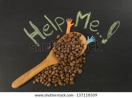 Coffee bean in wooden spoon with help me hand writing