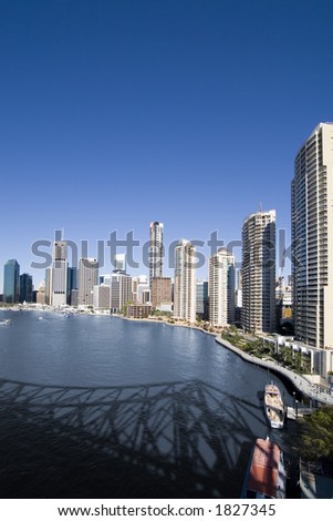 portrait of brisbane city skyline with river in front