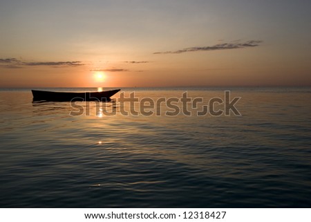 row boat at sunset in zanzibar africa