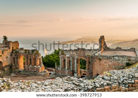 The famous and beautiful ancient greek theatre ruins Taormina in sunset, Messina, Sicily, Italy