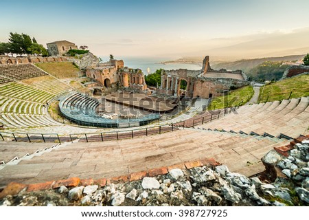 The famous and beautiful ancient greek theatre ruins Taormina in sunset, Messina, Sicily, Italy