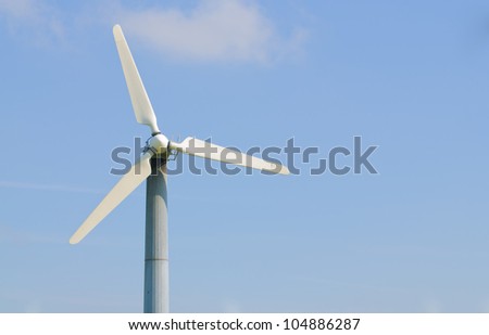 solitary wind turbine on a power generating farm in California, with room for your text