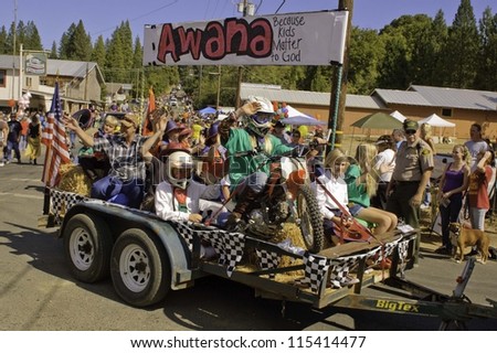 WEST POINT, CA - OCTOBER 6: Unidentified children on a float in the 38th  Lumberjack day  parade, on October 6, 2012 in West Point.