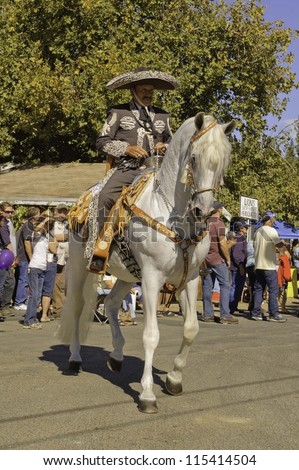 WEST POINT, CA - OCTOBER 6: Hispanic horseback rider in the 38th  Lumberjack day  parade, on October 6, 2012 in West Point.