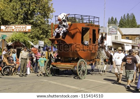 WEST POINT, CA - OCTOBER 6: Stage coach and people celebrating the 38th  Lumberjack day  parade, on October 6, 2012 in West Point.