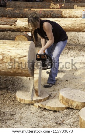 WEST POINT, CA-OCTOBER 6: Unidentified competitor in the woman\'s chainsaw event at Lumberjack day, on October 6, 2012 in West Point. West Point celebrates it\'s 38th Lumberjack day.