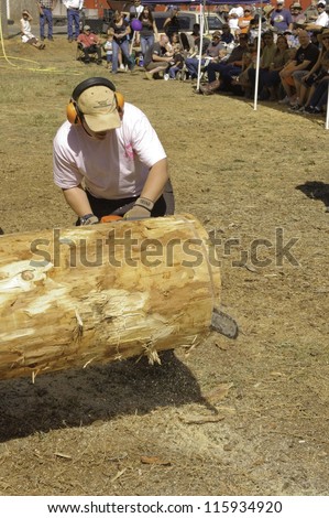 WEST POINT, CA-OCTOBER 6: Unidentified female competitor in Chainsaw event at the Lumberjack day , on October 6, 2012 in West Point. West Point celebrates it\'s 38th Lumberjack day.