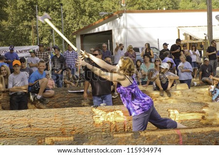 WEST POINT, CA - OCTOBER 6: Unidentified competitors in axe throwing event at the Lumberjack day, on October 6, 2012 in West Point. West Point celebrates it\'s 38th Lumberjack day.