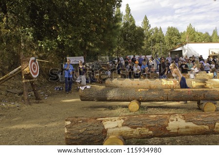 WEST POINT, CA - OCTOBER 6: Unidentified competitors in axe throwing event at the Lumberjack day, on October 6, 2012 in West Point. West Point celebrates it\'s 38th Lumberjack day.