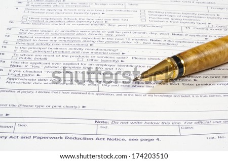 pen ready to use to fill out tax form ready for April taxes