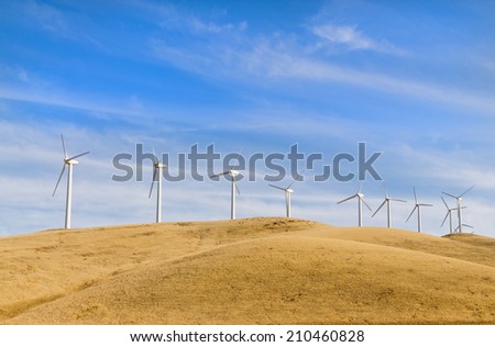 Sustainable electrical power generator powered by wind natural energy source, with copy space above and below the wind turbines
