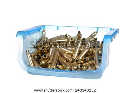 plastic container holding 7mm Magnum ammunition cartridge cases that have been cleaned , polished and had the primers removed ready for reloading