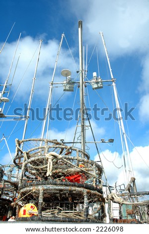 crab pots sitting on the deck of a boat in the fishing fleet
