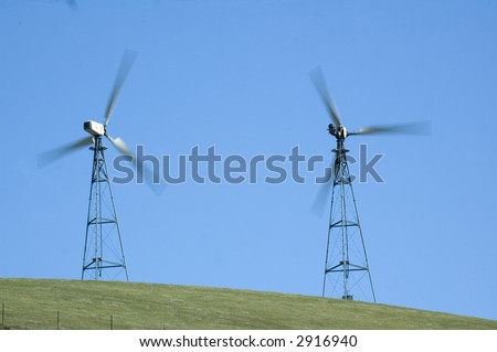 alternate energy wind generators in california with blades rotating at speed