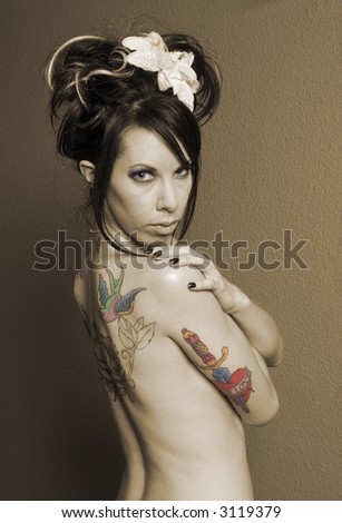 pretty girl tattoos. stock photo : Pretty girl with tattoo#39;s on back in sepia, layered then