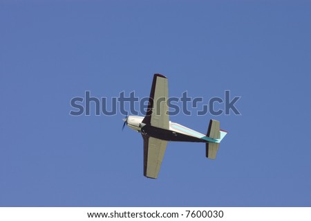 Small private aircraft with retractable undercarriage up right after takeoff