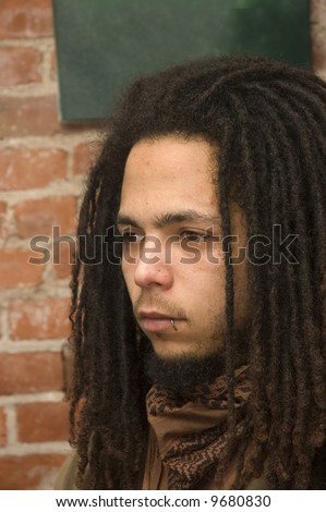 stock photo young african american man with dreadlocks lip and nose 