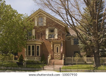 Older Victorian  or Georgian style home in Nevada, with Bay window and stoop