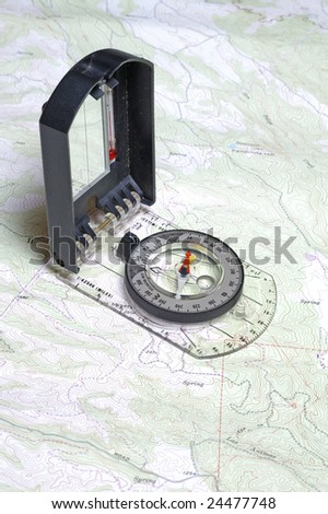 Closeup of compass and a topographical map showing detail