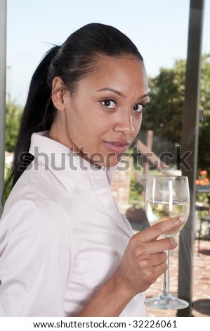 Beautiful african american woman relaxing with a glass of wine