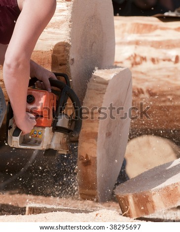 the moment of truth when during a log chainsaw competition the saw finally cuts through the log