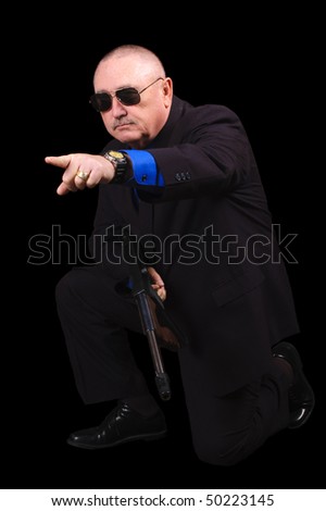 Gangster or Government agent, FBI agent, over a black background