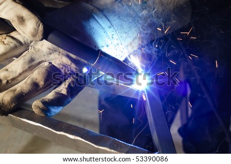 close up of Blacksmith welding on decorative handrail