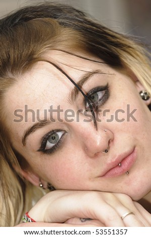 stock photo : Attractive female with a nose ring and lip piercing