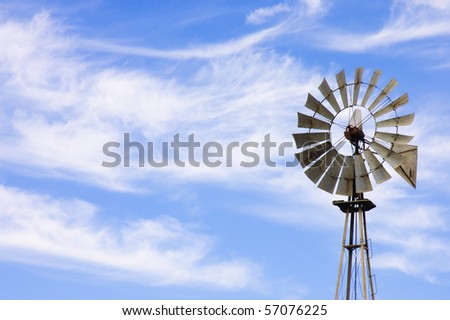 wind powered water pump on a farm in California