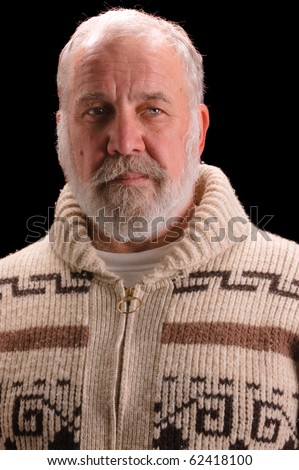 older man in a sweater looking like Ernest Hemingway