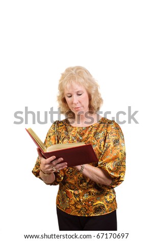 Older attractive blond-haired business woman checking in Address book isolated over white