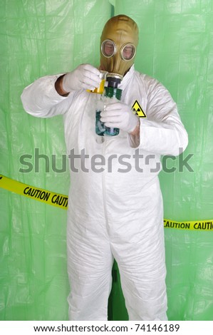 chemical engineer, or nuclear scientist mixing hazardous chemicals in clean room environment