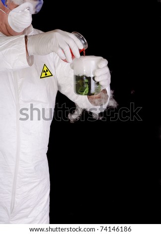 chemical engineer, or nuclear scientist mixing hazardous chemicals in clean room environment