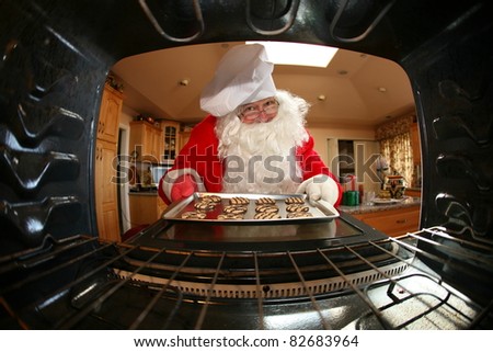 humorous image from within an oven of Santa in kitchen whipping up a batch of cookies,