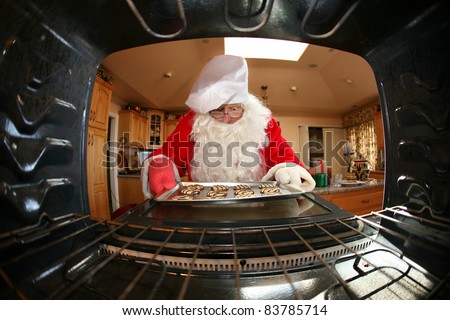 Santa in kitchen whipping up a batch of cookies,