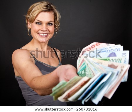 cute girl holding a lot of bank notes