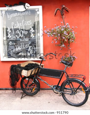 summer in the countryside  in denmark, bike in a village in denmark, the bike is placed in front of a fishermanshop