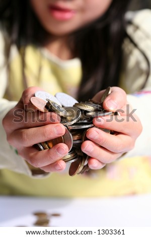 child holding   money in hands