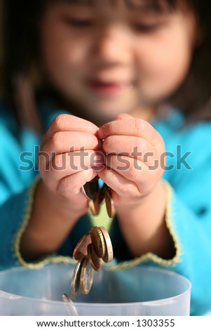 child holding   money in hands