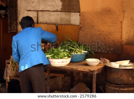 fruit and vegetables in a shop  in lanzhou china Gansu province,,a woman preparing food
